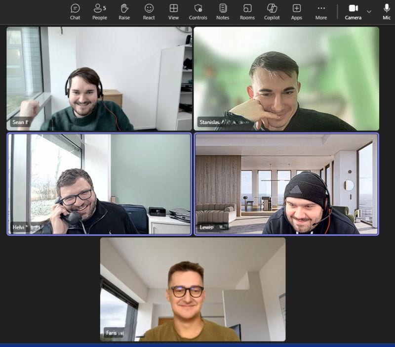 Five of the Eido engineering team on a video call, one of them holding a headset to his ear like a telephone.